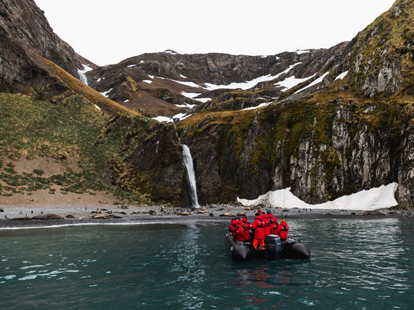 a group of travellers exploring Hercules Bay, Antarctica