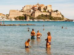 bathers cooling off at Calvi’s 13th-century citadel