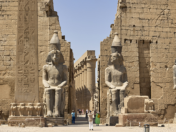 Statues of Ramses II at the entrance through the first Pylon of Luxor Temple, Luxor Temple, Egypt. One of the stops in Viking Cruises