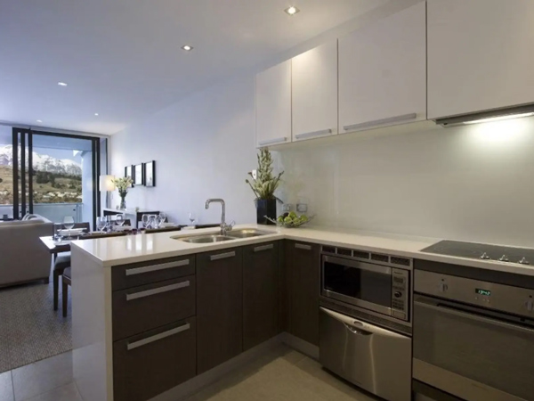 the kitchen and dining of the one bedroom lakeside view apartment at The Rees Queenstown