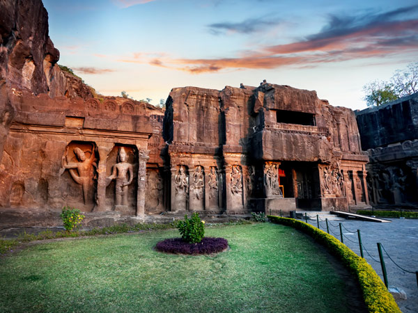 Ellora cave entrance in Kailas temple with ancient carved wall near Aurangabad, Maharashtra, India