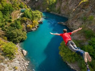 Man doing bungee jump from Kawarau Bridge Bungy in Queenstown, New Zealand