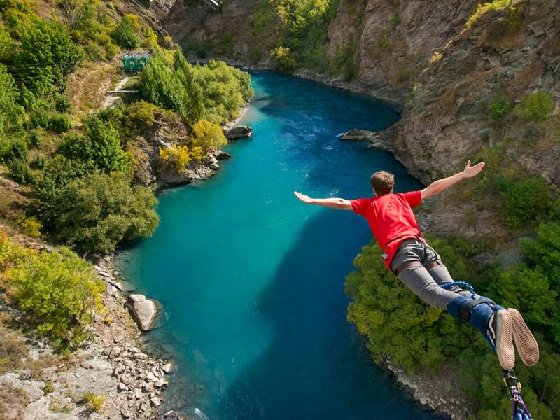 Man doing bungee jump from Kawarau Bridge Bungy in Queenstown, New Zealand