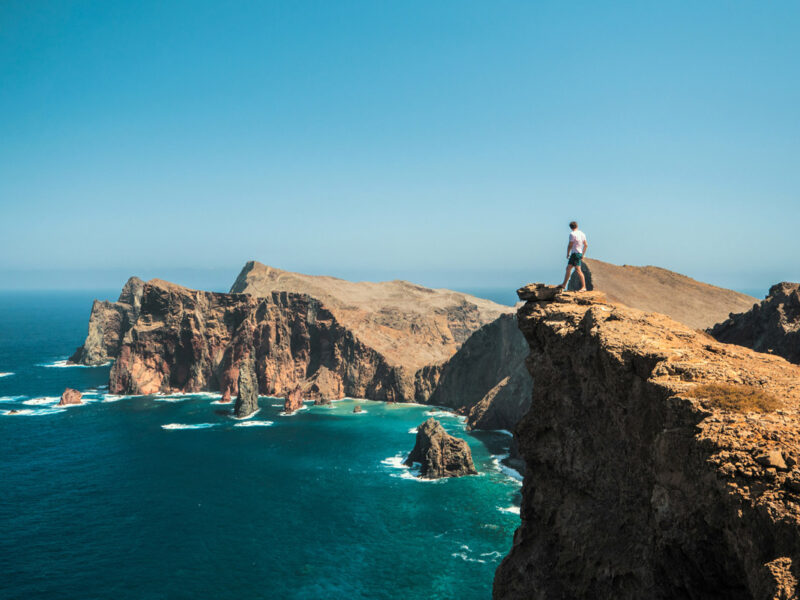 Man standing on cliff in Madeira