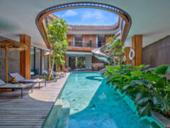 a pool with a spiral slide at Akashi Residence, Bali