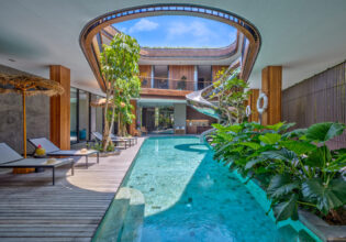 a pool with a spiral slide at Akashi Residence, Bali