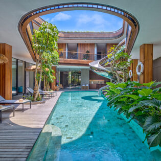 a pool with a spiral slide at Akashi Residence, Bali