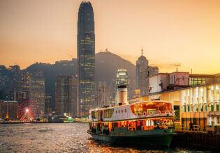 honk kong star ferry in victoria harbour at sunset