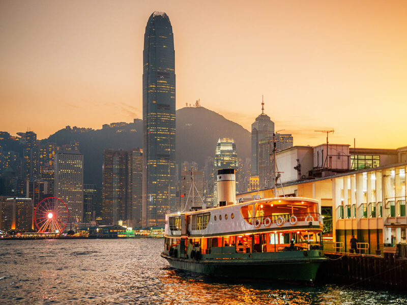 honk kong star ferry in victoria harbour at sunset