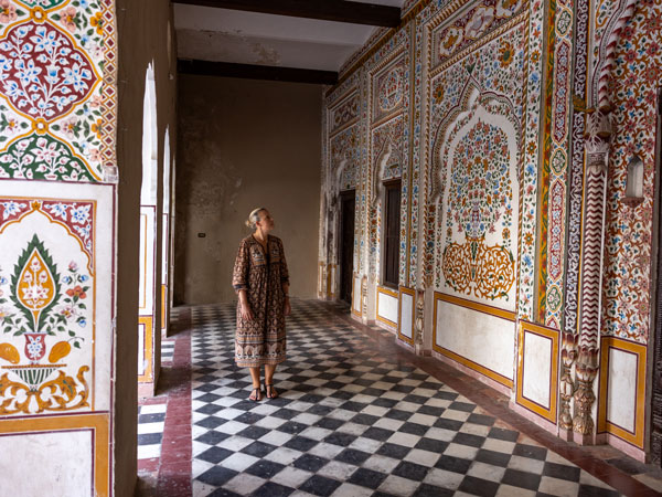 a woman exploring Hindu Dharamsala in Saidpur