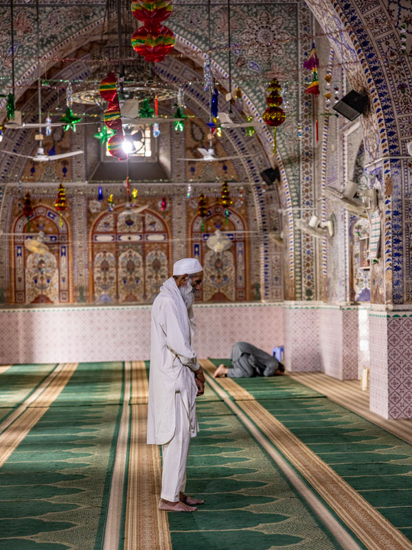 a man praying inside Markazi Jamia Mosque