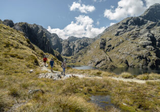 Three people going on a hike.