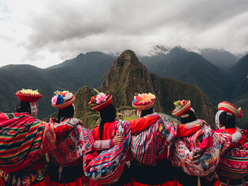 Quechua women from the Sacred Valley with arms linked