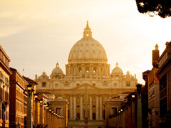 St. Peter's Basilica at sunset from Via della Conciliazione. Vatican City State. Rome, Italy.