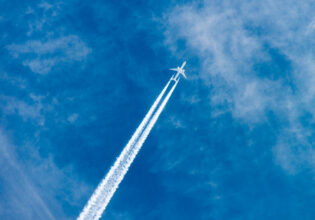passenger plane leaving slip stream through the air, farting on a plane​