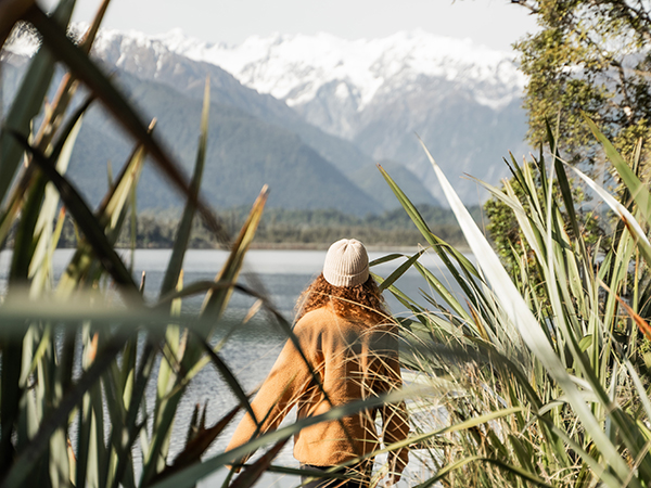 A girl gazing over majestic glacier vistas.