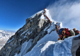 People queuing to reach Mount Everest Summit/Top of the World / Highest Mountain in the Himalayas Nepal