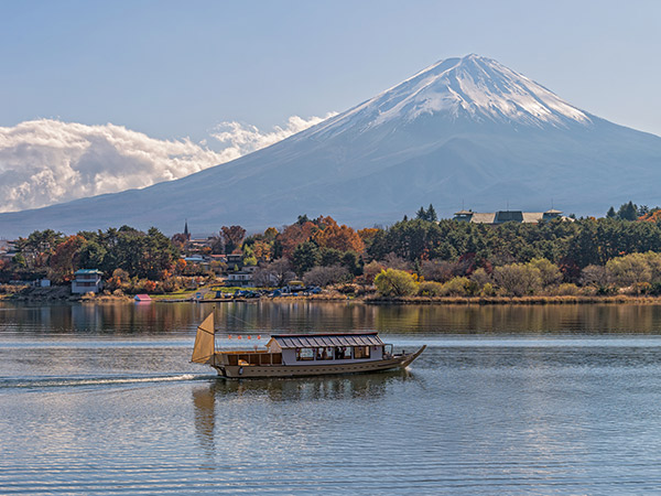 boat in front of mount fuji in japan