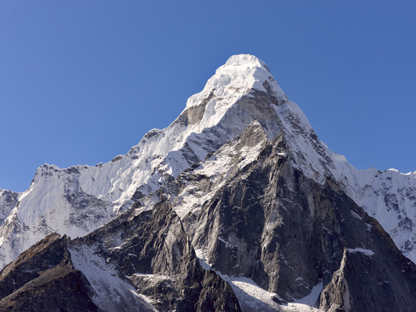 Mount Everest Circuit against a blue sky in the Himalayas Nepal