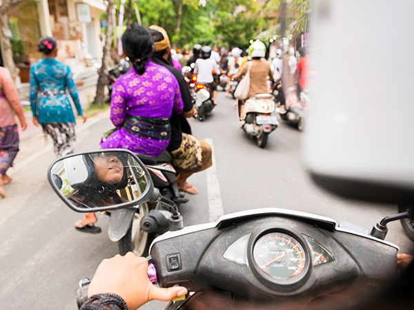 riding a scooter in Bali