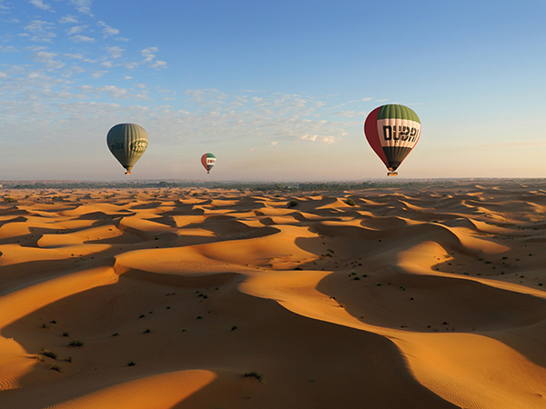Hot Air Balloon flying above the desert.
