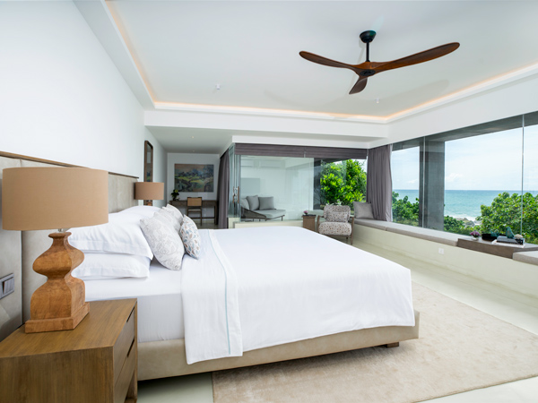 a bed with sea view at Uga Prāva
