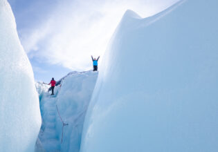 hikers at the top of Fox Glacier, west coast new zealand
