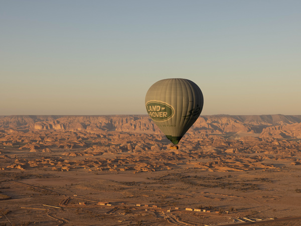 a hot air balloon soaring over Saudi Arabia