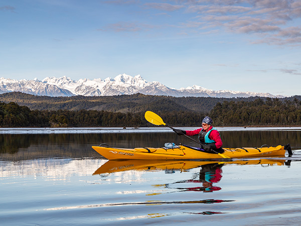 kayaker on Ōkārito Lagoon