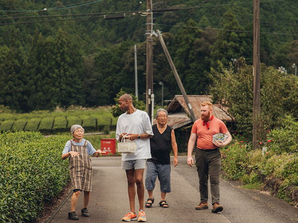 Tourists from Intrepid Travels walking with locals.