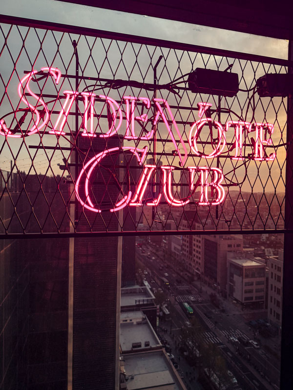 the neon-lit sign of Side Note Club, Ryse Hotel, South Korea