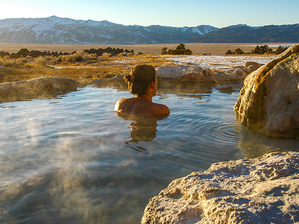 woman in Sierra Nevada Hot Spring, california road trip stop
