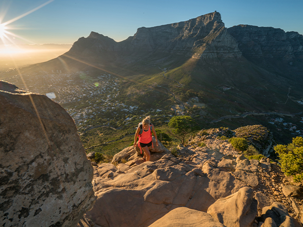 A hiker hiking up a mountain in Cape Town.