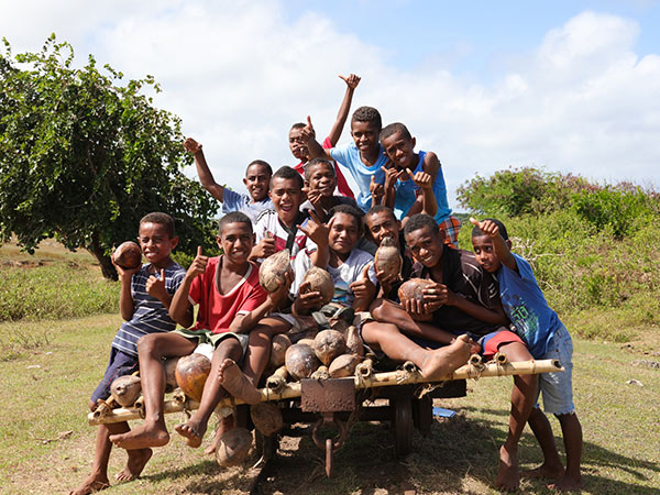Happy children, sitting on a bogie near Natadola beach on Viti Levu, Fiji islands