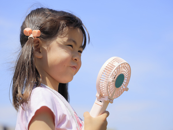 Japanese girl with portable fan
