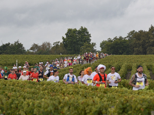 Runners in the Marathon du Médoc in Bordeaux, France