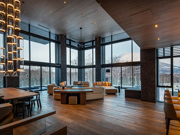 Floor-to-ceiling windows with the view of the mountain at Corniche Hirafu Chalet.