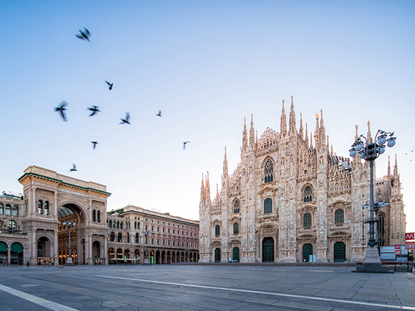 Morning scene at Galleria Vittorio Emanuele and Milan Cathedral Square with pigeons in flight during a Singapore Airlines Stopover.