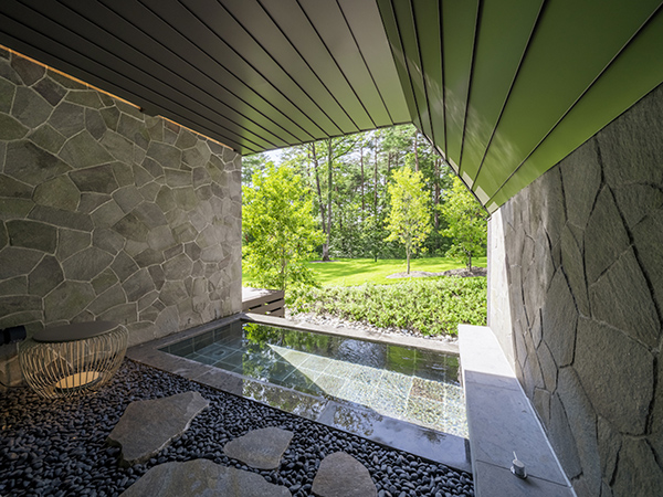 Your own open-air onsen, where steam meets the crisp mountain air.