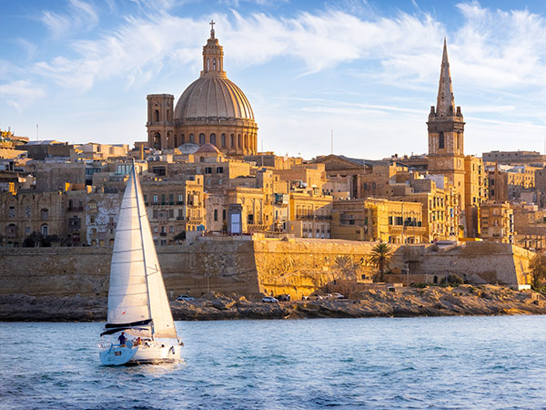 sailboat in front of valetta malta island