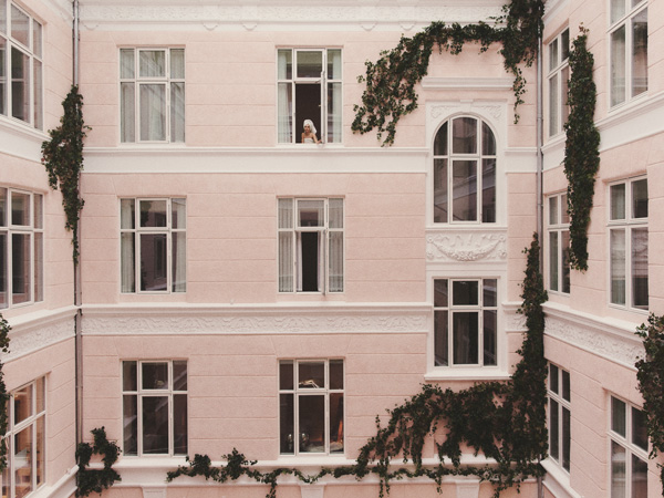 facade of Hotel Bella Grande with many windows