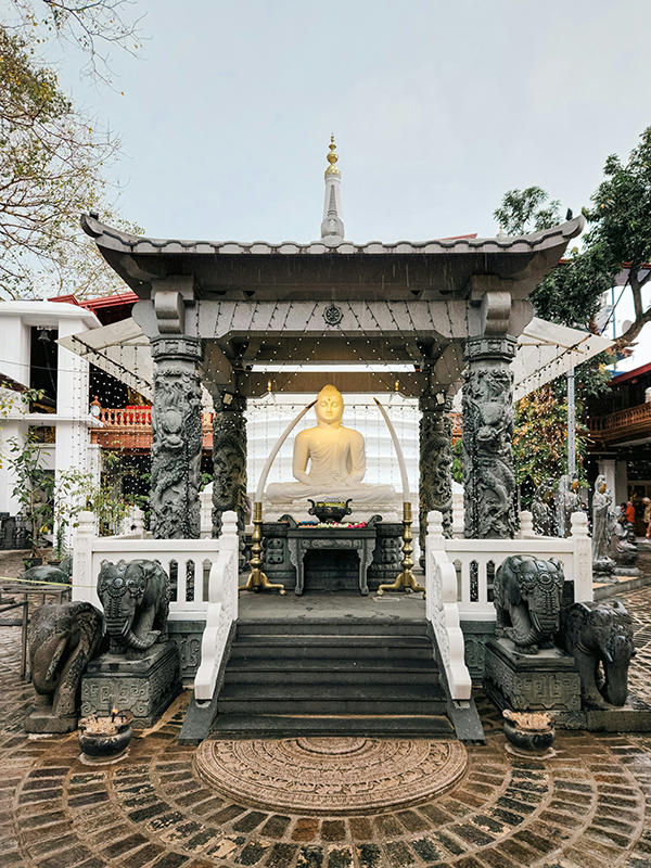 Interior of Gangaramaya Temple in Colombo showing traditional Buddhist design.