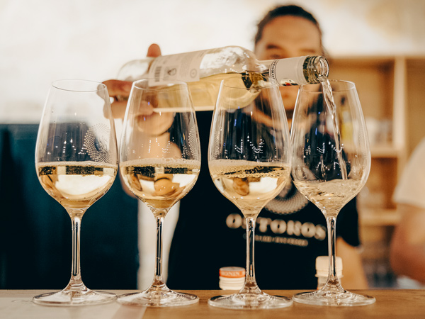 wine being poured into a glass at Ostoros Winery