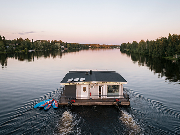 The cosy charm of a sauna ferry drifting along Finland’s tranquil rivers.