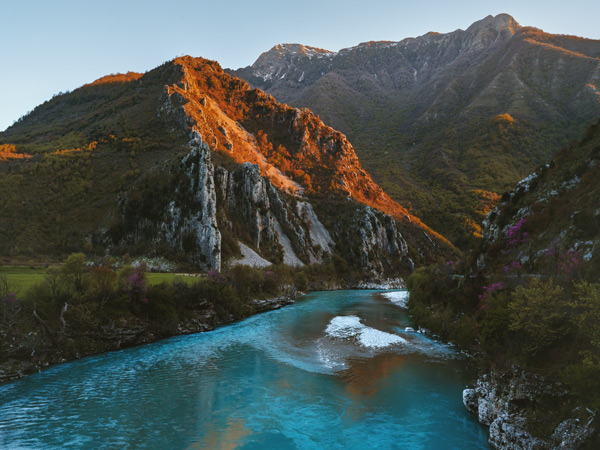 a scenic river and mountain landscape in Albania