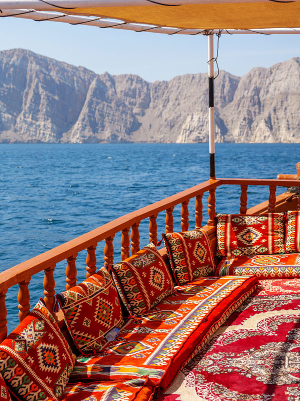 a traditional dhow boat along the coast of Khasab, Musandam, Oman