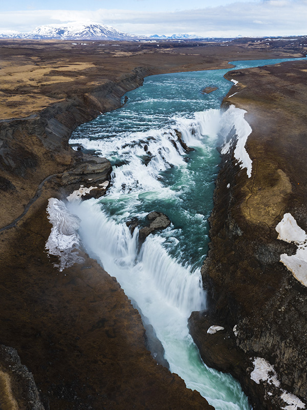 Aerial view of Gullfoss waterfall cascading through a canyon in south Iceland.
