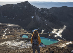 A woman gazing at the striking view of Mt Ngauruhoe.