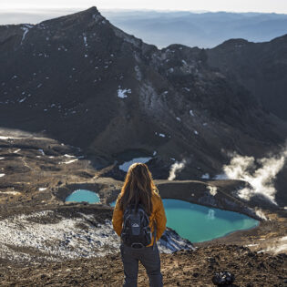 A woman gazing at the striking view of Mt Ngauruhoe.