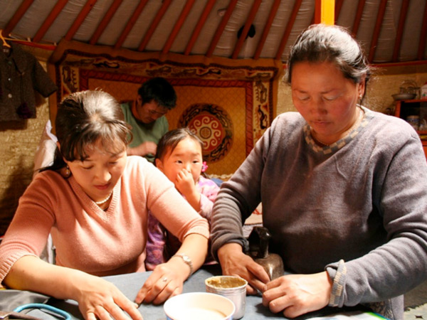 Mongolian locals making traditional crafts